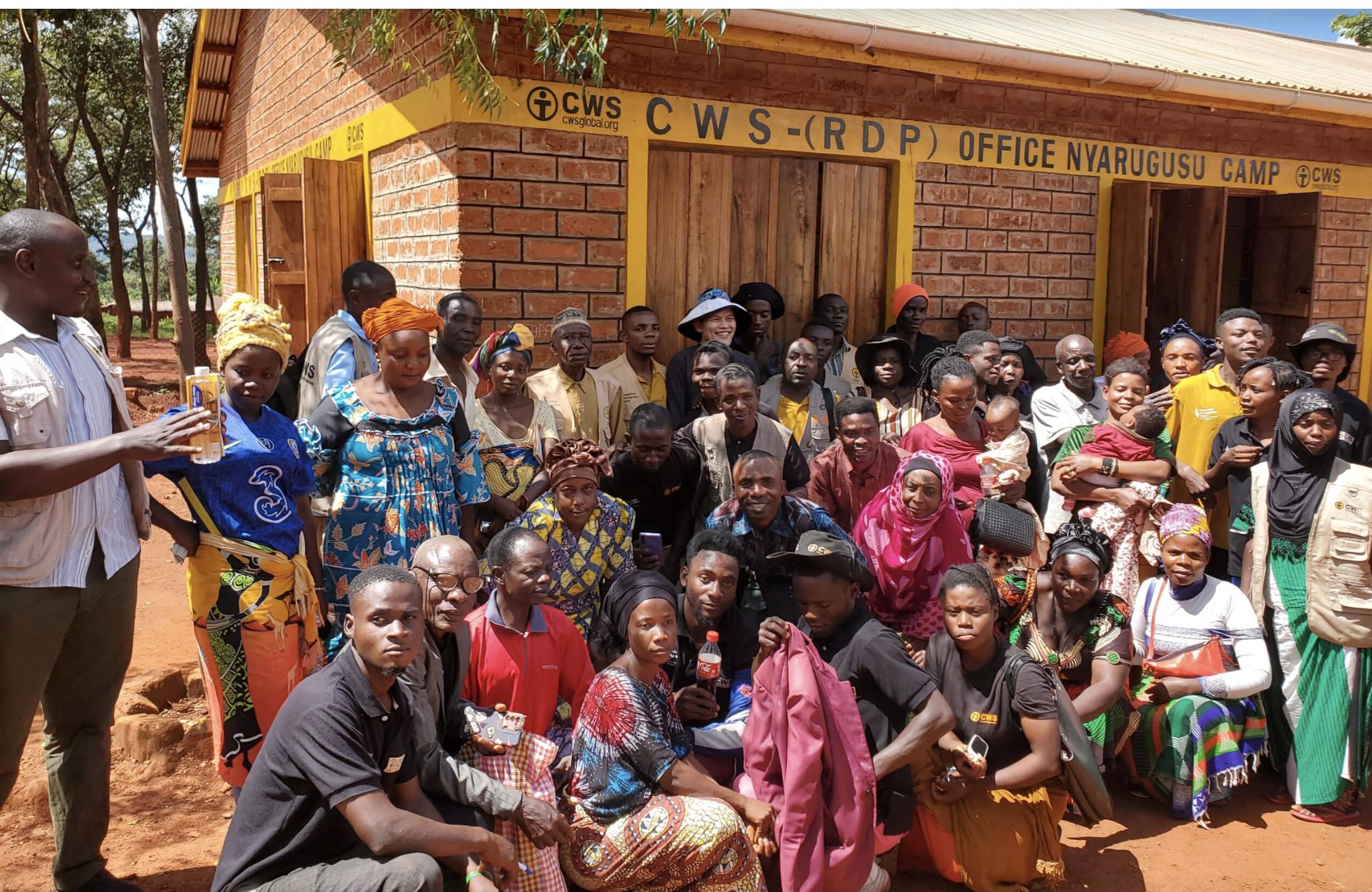 a group of Congolege refugees pose for a photograph at the Nyarugushu refugee camp